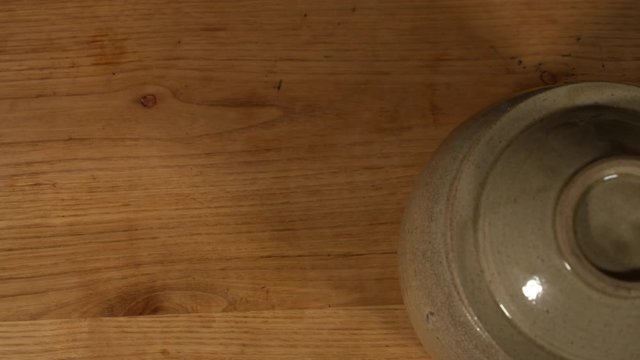 a Japanese female chef preparing Nanko-Ume plums at her home kitchen, Tokyo, Japan. July 2019. Camera fixed, close-up, bird's eye view