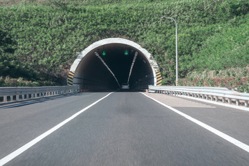 Entrance to a country road tunnel - 295011345