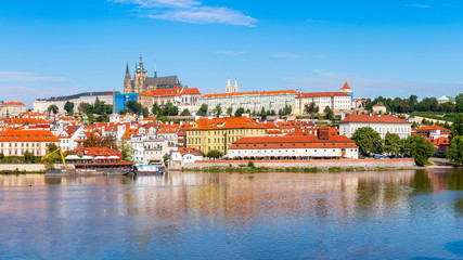 Fototapeta na wymiar The Vltava River in Prague with the St. Vitus Cathedral