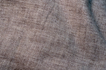 Crumpled textile texture as a background. Natural fabric linen texture for design. Closeup