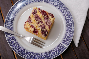 piece of blueberry cake with cream