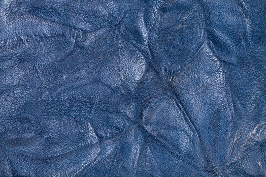 textured background from blue crumpled leather