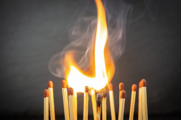 A group of matches, some of which are burning
