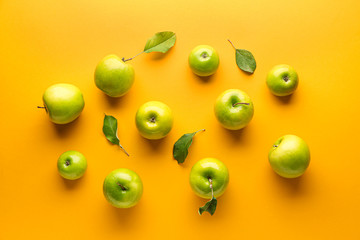 Fresh ripe apples on color background