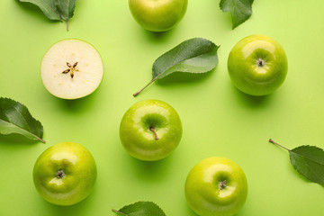 Fresh ripe apples on color background