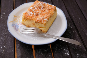 slice of cream cake on a plate