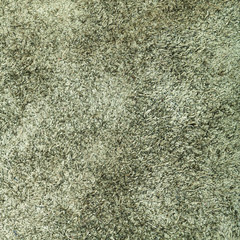 background from dark olive green suede close up