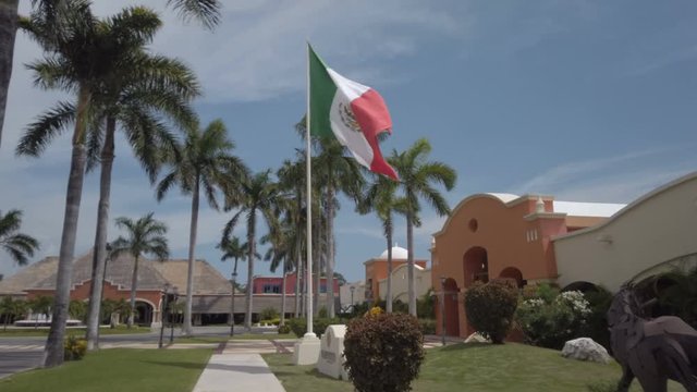 Large Mexican Flag Blowing In The wind near Tulum Mexico,  Yucatan Peninsula