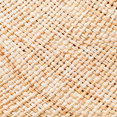 texture of straw hat from interwoven raffia fibers