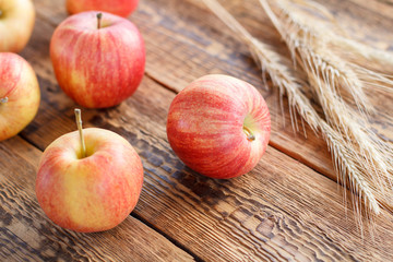 Apples close-up over the wooden natural background