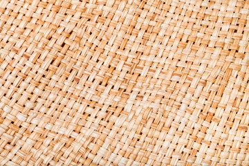 weaving of straw hat from natural raffia fibers