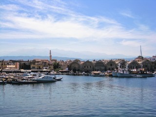 The coastal area, old harbour and the characteristic Venetian buildings in Chania town, Crete, Greece.