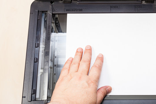 top view of putting of paper on glass of scanner