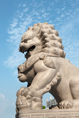 Fototapeta na wymiar close up of Lion Guardian sculpture at Chinese style temple in Thailand