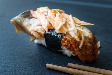 Unagi Nigiri Sushi with Ginger, Wasabi, Soy Sauce and Chopsticks.