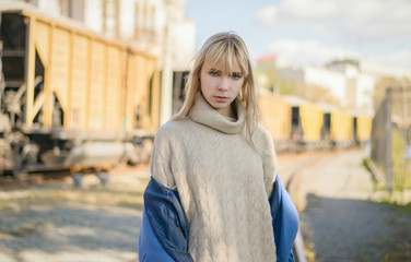 Fototapeta na wymiar Portrait of young woman wearing blue coat.