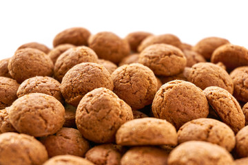 Close-up rows of many dutch ginger nuts candy. Also known as pepernoten or kruidnoten for the Dutch annual children's feast Sinterklaas on the 5th of december. Isolated on top for copy space.