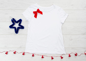 Close up white blank template t shirt with copy space and Christmas Holiday concept. Top view...
