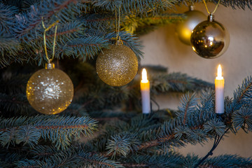 Christmas impressions with candles, Christmas tree, fir branches, Christmas decorations and Christmas cookies