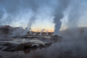 Northern Chile - San Pedro de Atacama and surrounding area - El Tatio geyser field and the hundreds of rocky geysers venting from dawn until dusk illuminated beautifully by the sunrise