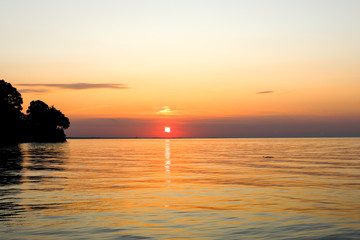 Fototapeta na wymiar Beautiful summer sunset on Lake Ontario. Webster, NY