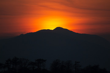 Fototapeta na wymiar Sunset over mountains near Glencoe, Scotland