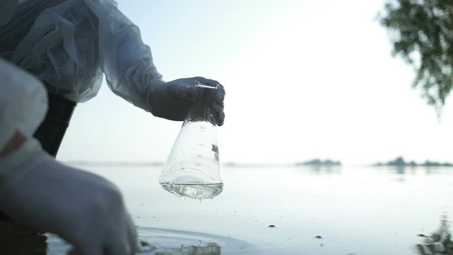 Scientist tests water for infections, harmful emissions
