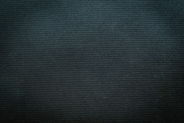 Close-up of black gray fabric texture. Surface detail of canvas textile rough abstract dark black clothes background. Design in your work backdrop, concept copy space for text.