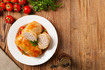 Traditional stuffed cabbage with minced meat and rice, served in a tomato sauce.
