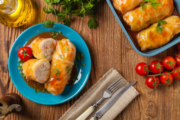 Traditional stuffed cabbage with minced meat and rice, served in a tomato sauce.