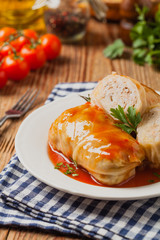 Traditional stuffed cabbage with minced meat and rice, served in a tomato sauce.