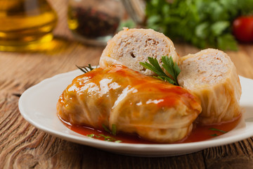 Traditional stuffed cabbage with minced meat and rice, served in a tomato sauce.