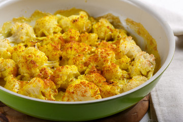 Turmeric and coconut milk baked cauliflower, vegetable recipe. Vegetarian or vegan diet, healthy...