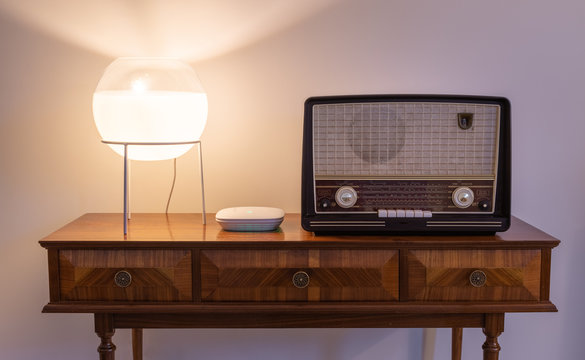 Modern Versus Old Technology - New Wi-fi Access Point Next To An Historic Radio