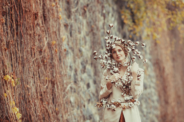 Beauty and nature. Tender woman with cotton flowers.