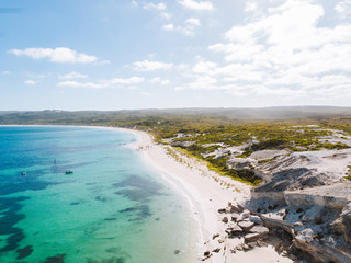 Aerial drone landscape of Hamlin Bay, Western Australia. Paradise like waters with jagged rocks surrounding the perfect beach. 
