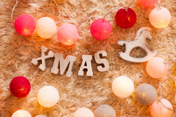 Obraz na płótnie Canvas Christmas decor with color lights balls and word XMAS