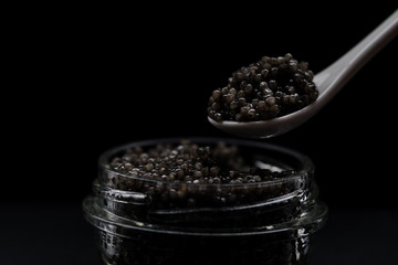 Fototapeta na wymiar Black sturgeon caviar on a spoon