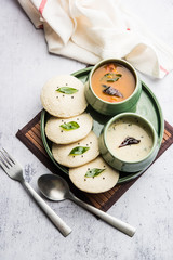 Idli Sambhar or Idly Sambar is a popular south Indian food, served with coconut chutney. selective focus