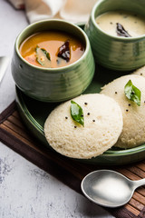 Idli Sambhar or Idly Sambar is a popular south Indian food, served with coconut chutney. selective focus