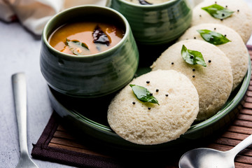 Idli Sambhar or Idly Sambar is a popular south Indian food, served with coconut chutney. selective focus