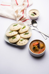 Idli Sambhar or Idly Sambar is a popular south Indian food, served with coconut chutney. selective focus