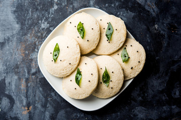Idli Sambhar or Idly Sambar is a popular south Indian food, served with coconut chutney. selective focus