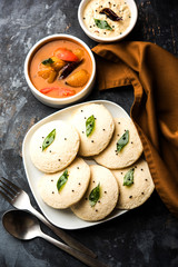 Idli Sambhar or Idly Sambar is a popular south Indian food, served with coconut chutney. selective focus