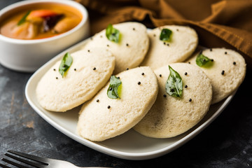 Idli Sambhar or Idly Sambar is a popular south Indian food, served with coconut chutney. selective focus