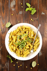 pasta with pesto sauce and basil