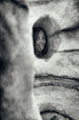 Happy woman visiting ice cave showing her tongue