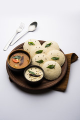 Idli Sambhar or Idly Sambar is a popular south Indian food, served with coconut chutney. selective focus