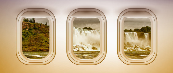 Airplane interior with window view of Niagara Falls, USA. Concept of travel and air transportation