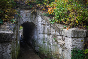Gray stone tunnel. Passage through the tunnel